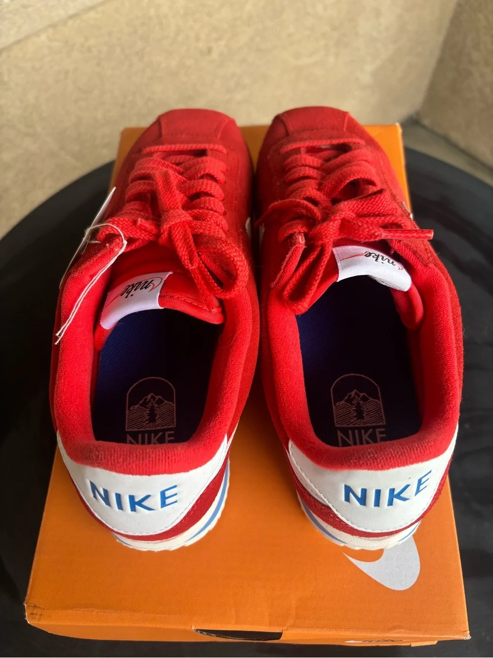 Nike women’s Red Suede Athletic Sneakers with White Swoosh